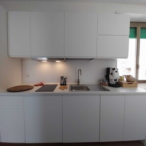 Fridge, microwave, stovetop, coffee/tea maker