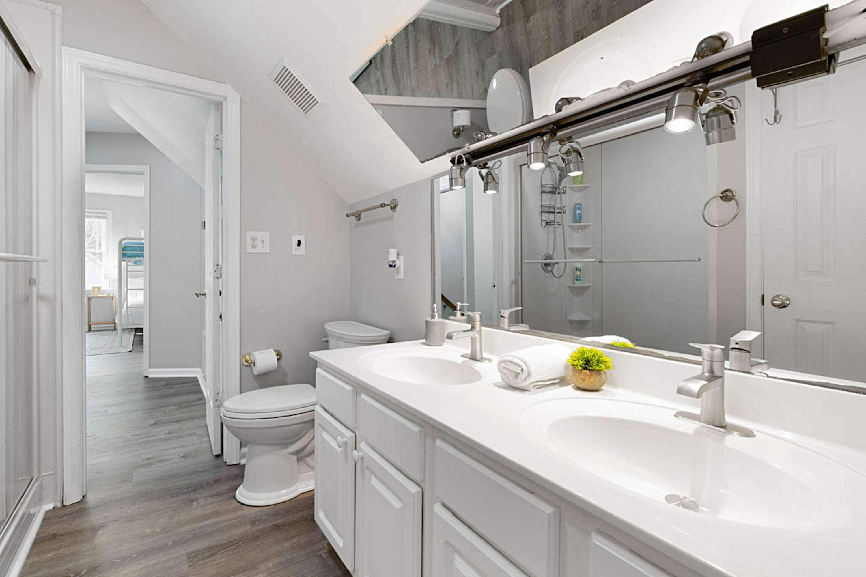 Shower, hair dryer, towels, shampoo