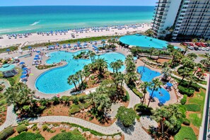 A resort with multiple swimming pools, a beach, and a tall hotel building. - Edgewater Villas #2108 - 2 Bedroom/2Bath Sleeps 8.  Free Fun! (Panama City Beach)