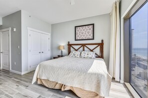 (King) Bed and closet with full length windows to view the Gulf