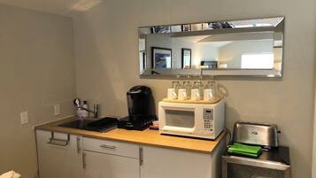 Fridge, microwave, coffee/tea maker, toaster