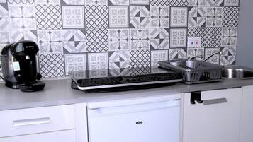 Fridge, microwave, coffee/tea maker, cookware/dishes/utensils