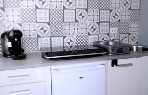 Fridge, microwave, coffee/tea maker, cookware/dishes/utensils