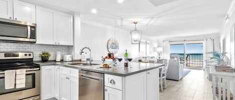 Coffee/tea maker, fridge, microwave, oven