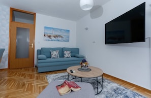 Apartment (Two bedroom Apartment with Balcony an) | Living room | 32-inch flat-screen TV with cable channels