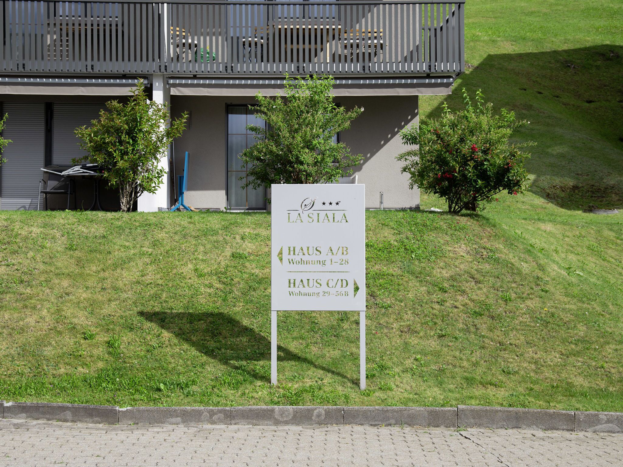 A sign for La Siala hotel with room numbers and types.