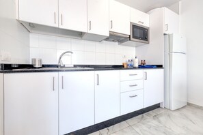 Fridge, microwave, stovetop, cookware/dishes/utensils