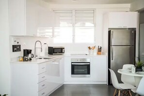 Fridge, microwave, oven, stovetop - NEW! Walk to Beaches + Restaurants + Close to SJU and Isla Verde in San Juan! (San Juan)