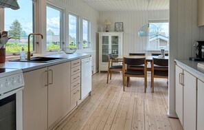 Fridge, stovetop, dishwasher, coffee/tea maker