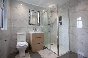 Shower, hair dryer, towels