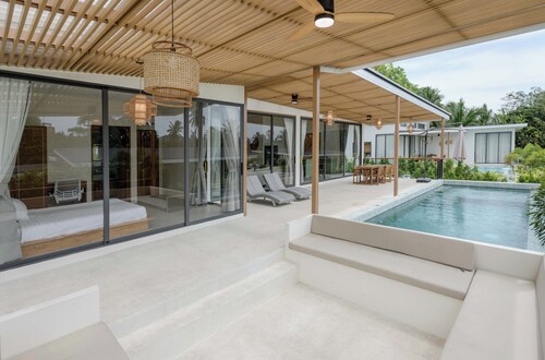 Tropical Poolside Retreat by Sea N' Rent