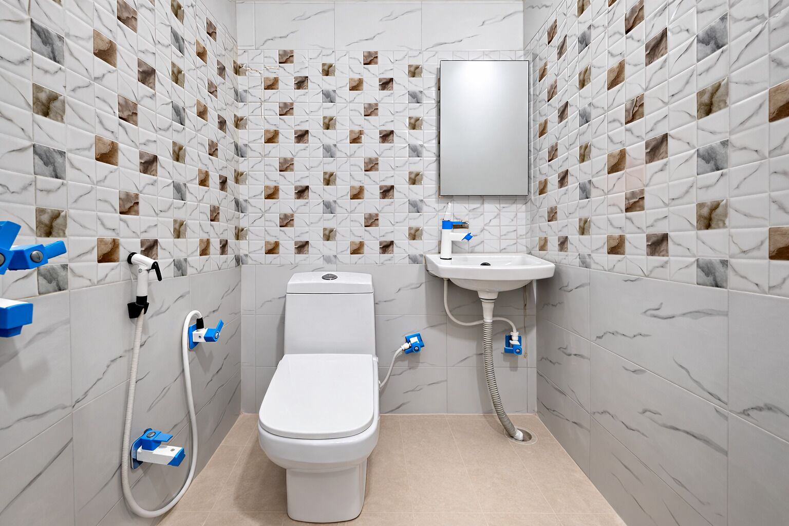 A modern bathroom with a toilet, sink, and shower.