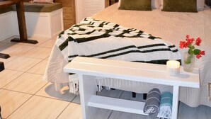 A bedroom with a bed, bedside table, and a small desk area. - NEW LISTING! Your Private Paradise on St. John’s Beautiful Bordeaux Mountain (St John)