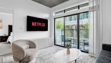 65-inch flat-screen TV with cable channels