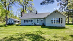 A single-story house with a gabled roof, a chimney, and a front porch. - Hackensack Waterfront Retreat on Tenmile Lake (Hackensack)