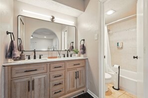 Shower, hair dryer, towels, shampoo