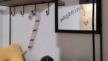 A wall-mounted mirror with the words "Good morning" and a heart symbol.