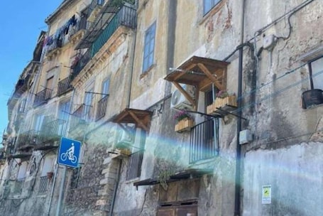 Exterior. Along Crati River, mini apartment, vico Postierla, historic center.