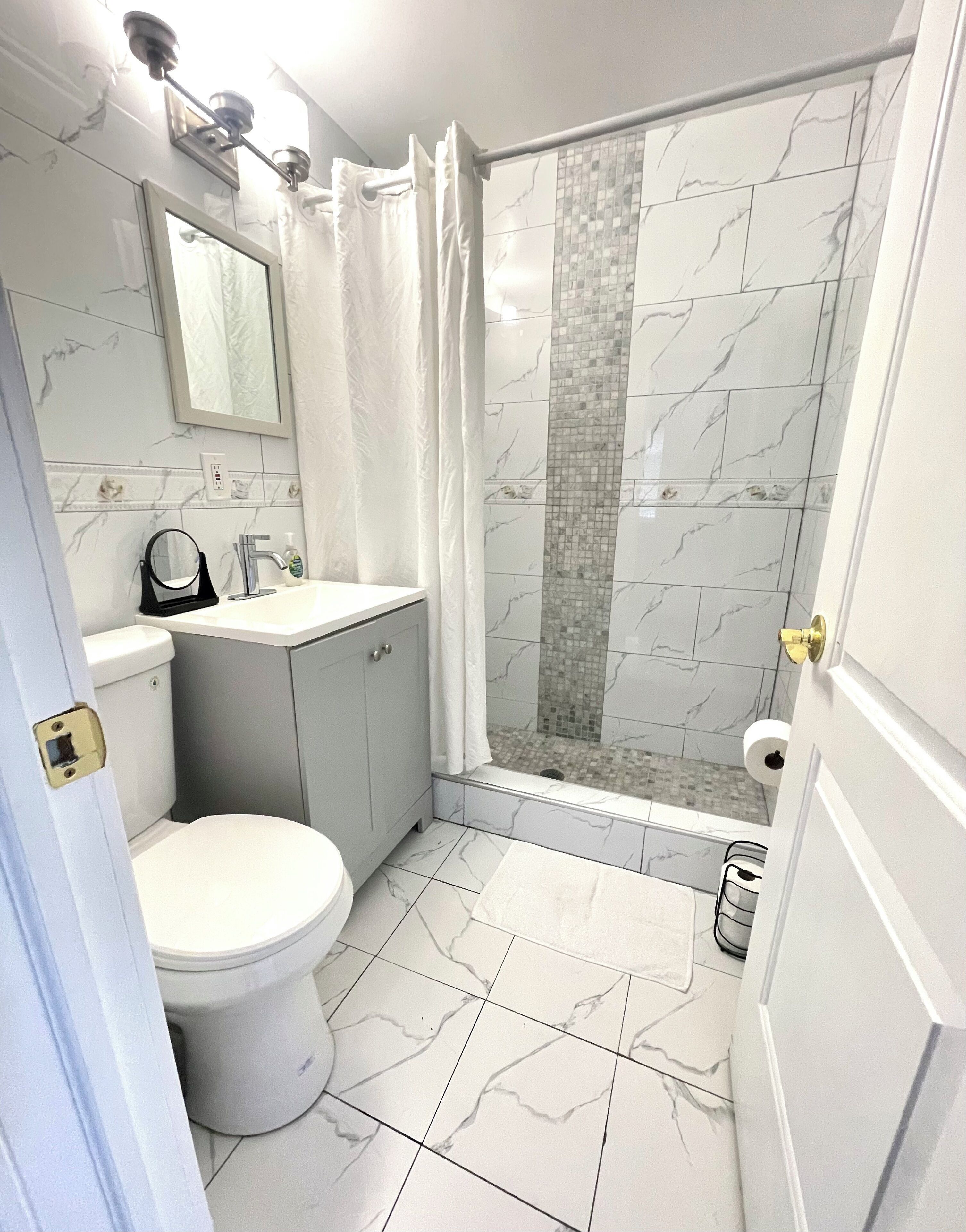 Shower, hair dryer, towels, soap