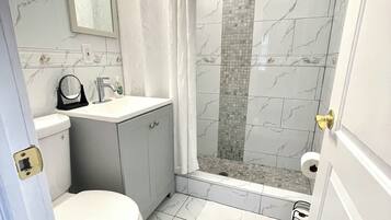 Shower, hair dryer, towels, soap