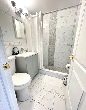 Shower, hair dryer, towels, soap