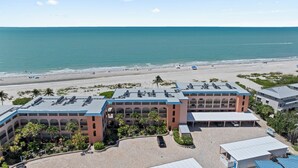 A hotel with a rooftop parking area, a beach view, and a pool. - OCEAN'S REACH 3X3: 1-Bdrm, 3rd Floor, Gulf Front Views, All Amenities Open! (Sanibel Island)