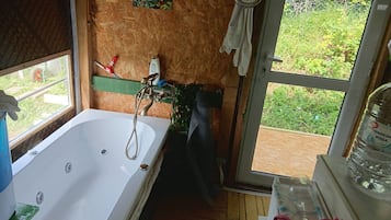 Shower, jetted bath, towels, toilet paper