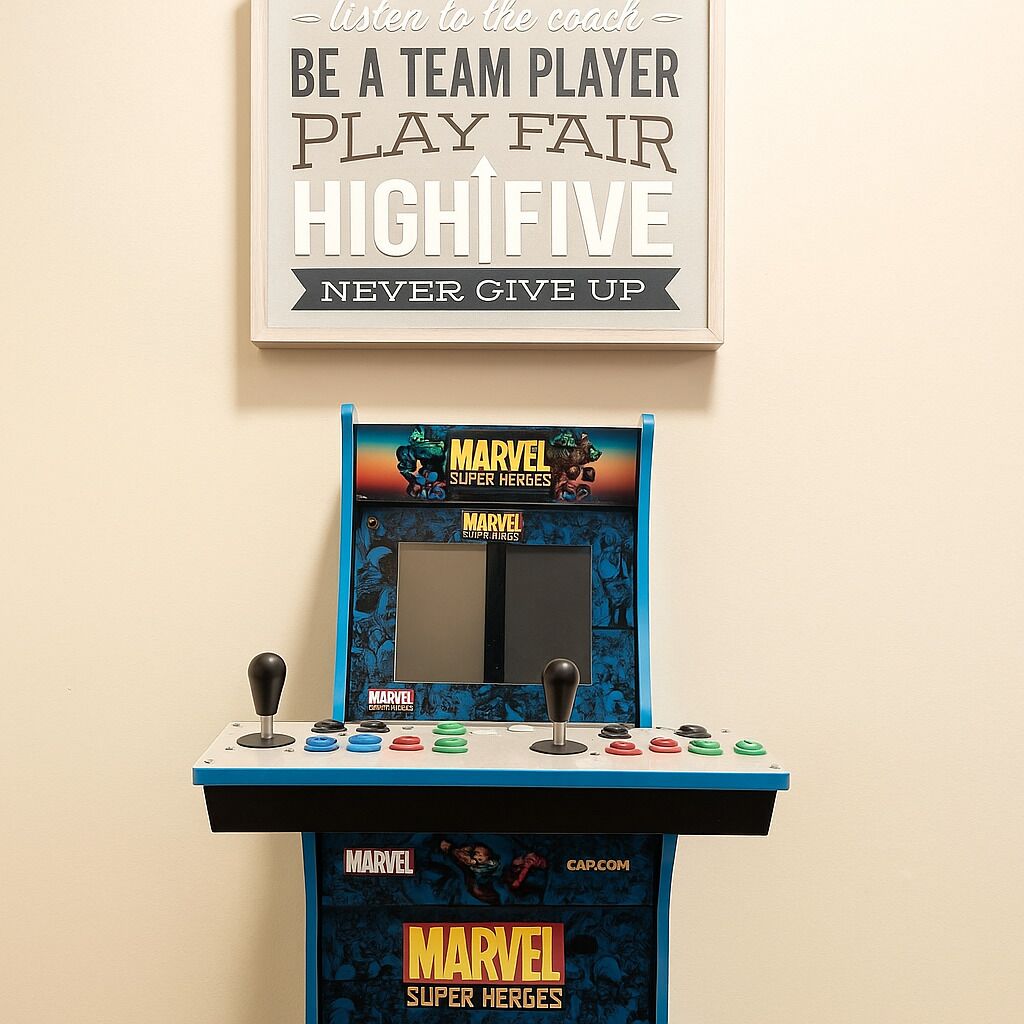 A small arcade machine with a sign above it that reads "listen to the coach - BE A TEAM PLAYER PLAY FAIR HIGH FIVE NEVER GIVE UP".
