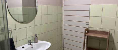 Shower, towels, soap, toilet paper