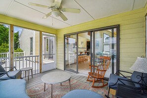 A covered patio with a table, chairs, and a ceiling fan. - 3 BR/2BA home in So. Bethany (South Bethany)