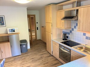 Apartment, Balcony, Mountain View | Private kitchen - Siegmundshof Hotel Garni (Saalbach)