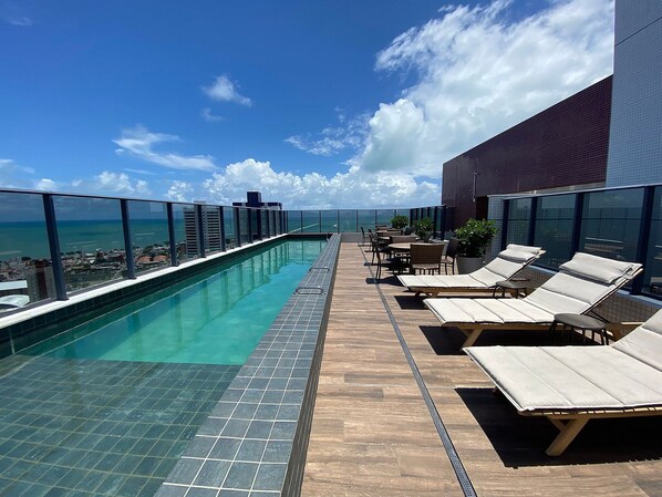 Design Apartment | Pool | Outdoor pool, open 6:00 AM to 10:00 PM, pool umbrellas, sun loungers