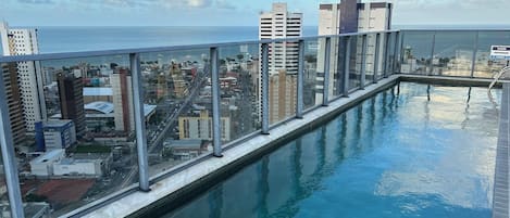 Outdoor pool, open 6:00 AM to 10:00 PM, pool umbrellas, sun loungers