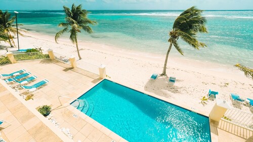 Spacious 2-bedroom ocean view condo in enchanting Bodden Town, including a car!