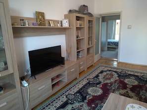 Apartment, 2 Bedrooms, Smoking, Balcony | Living room | Books - Apartment 3 Rooms, Nearby Casino, Cliff, Port, Aquarium, Beach, Ovidius Square (Constanta)