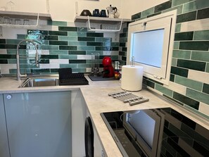 Fridge, microwave, stovetop, coffee/tea maker