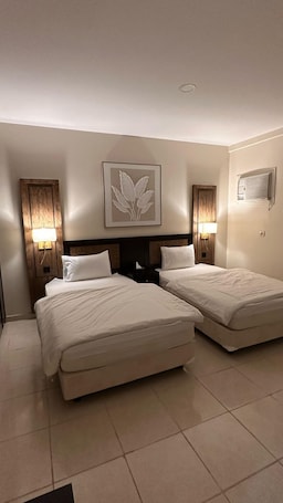 Family Apartment | Blackout drapes, iron/ironing board, free WiFi. AlShowaish Apartments