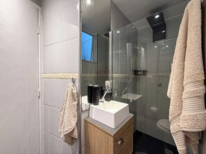 Shower, hair dryer, towels, soap