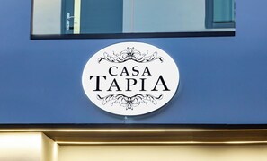 A circular sign with the text 'CASA TAPIA' on a blue wall. - Modern San Juan Apt w/ Parking Near Ocean Park (San Juan)