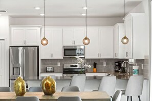 Microwave, stovetop, dishwasher, coffee/tea maker