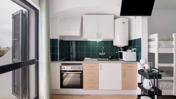 Fridge, microwave, coffee/tea maker, cookware/dishes/utensils