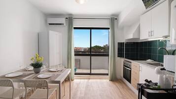 Fridge, microwave, coffee/tea maker, cookware/dishes/utensils