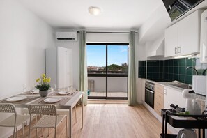 Fridge, microwave, coffee/tea maker, cookware/dishes/utensils