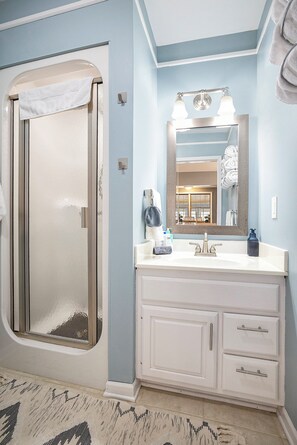 Shower, hair dryer, towels, soap