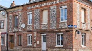 A two-story brick building with a sign reading "LAMPERRE." - Gîtes de France® - La Lampèrierre (SAINT SAENS)