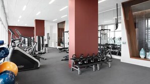 A gym with treadmills, weight machines, and kettlebells. - Stylish, centrally-located condo in Uptown/West Village with high-end amenities! (Dallas)