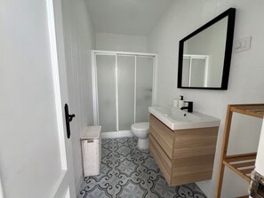 Shower, hair dryer, towels, soap