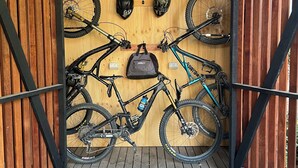 A wooden bike rack with two bicycles and helmets. - Convenient & Cosy Mountain Retreat in Omeo. (Omeo)