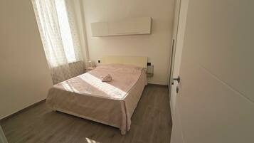 1 bedroom, desk, iron/ironing board, travel crib