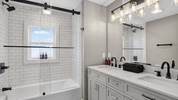 Shower, hair dryer, towels, shampoo